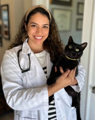 a woman holding a cat