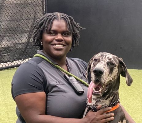 a woman holding a dog
