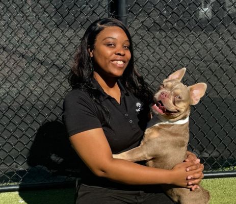 a woman holding a dog