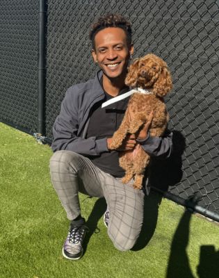 a man holding a dog