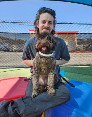 a man holding a dog