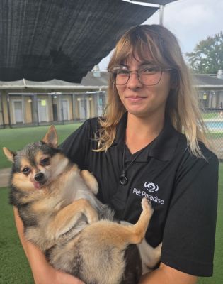 a woman holding a dog