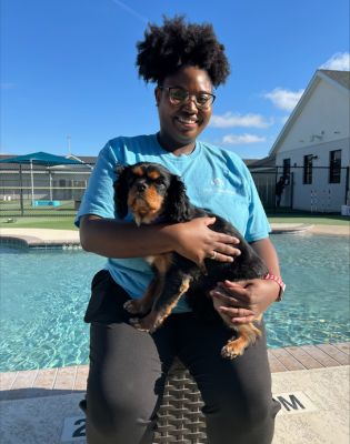 a woman holding a dog
